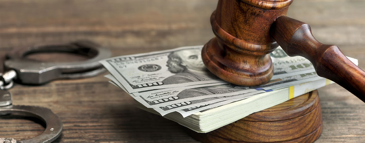 Gavel on Top of a Stack of 100 Dollar Bills